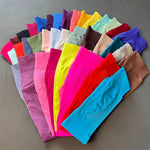 Maker flat lay fanning out the seamless leggings across more than twenty colourways