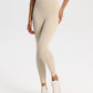 Women's high-rise ankle-length yoga leggings, four-way stretch knit, studio model shot
