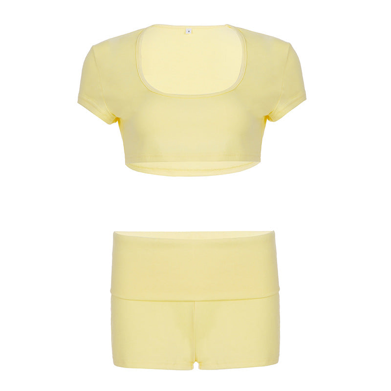 Flat view of the pale yellow U-neck crop top above the fold-over shorts, size L option