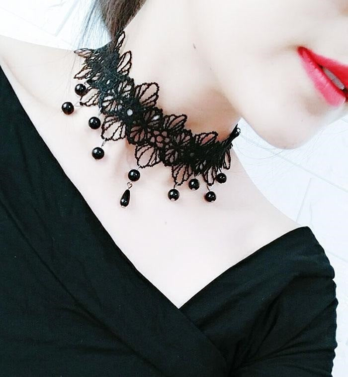 Gothic style vintage lace choker necklace shown close at the neck
