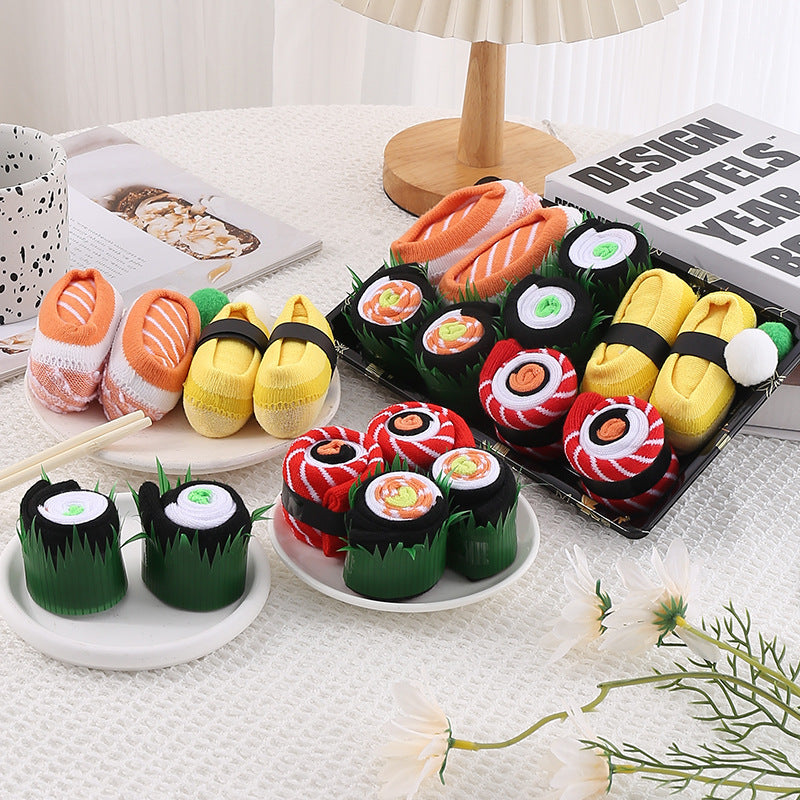 Flat lay of food pattern cotton crew socks in bright colours, sushi and roll designs knit into the cotton