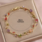 Gold plated leaf bracelet shown with its clean retail packaging