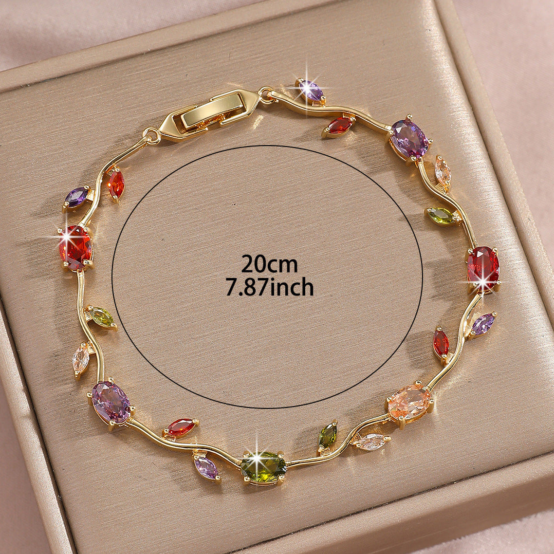 Gold plated leaf bracelet shown with its clean retail packaging