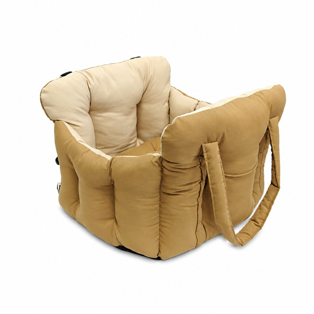 Padded car seat pet bed with raised bolster walls, carry handles and an inner clip the larger size shown on a bench seat
