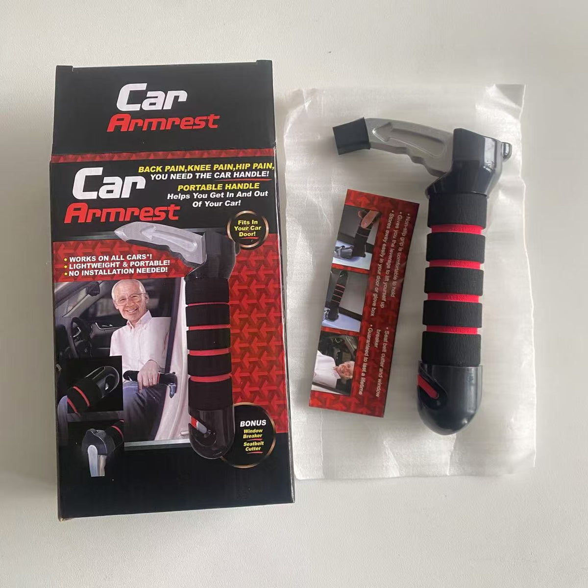 Retail box beside the portable car assist handle with a red foam grip, silver tip and instruction card