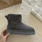 Gray suede platform ankle boot with a back bow held in a hand, Gray Thick Sole option, size 37