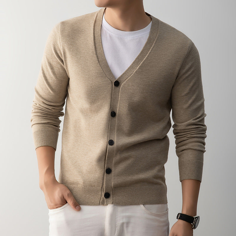 Light gray V neck button front cardigan shown on a model over a plain tee