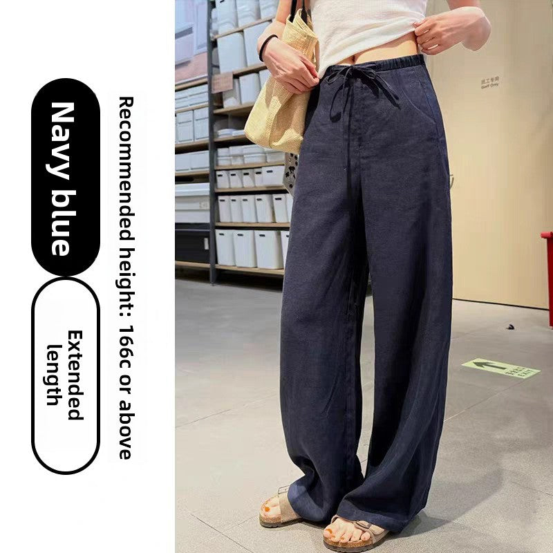 Womens high waist wide leg linen blend drawstring trousers, styled with a knit tank for a warm weather look