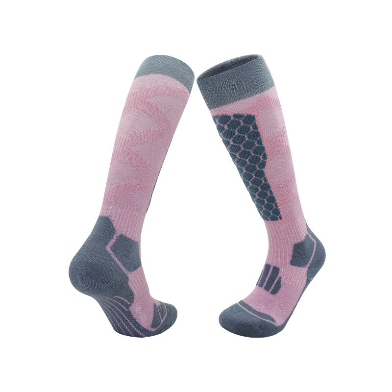 Sport ski socks knit with contrast panels and a plush cushioned sole on a white ground