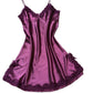Plum satin slip nightdress with matching lace trim at the neckline and hem, laid flat on white