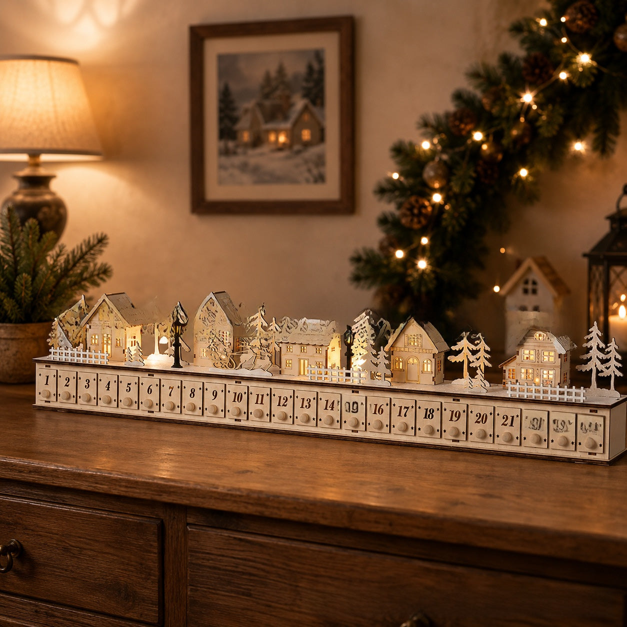 Natural white wooden advent calendar village glowing beside a Christmas tree