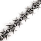 Spiked chainmail cuff bracelet shown on the arm in a silver tone finish