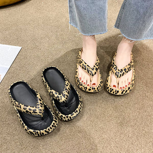 Cushioned thong flip flops with a single toe post strap and round toe footbed