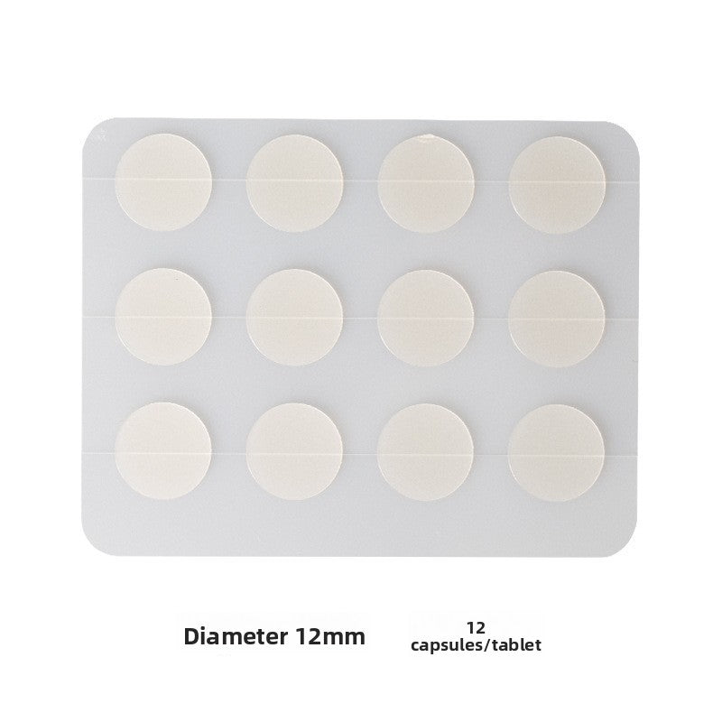 Sheet of twelve round hydrocolloid discs, each one twelve millimetres across, on white