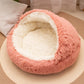 Round plush pet nest with a soft shell hood shown at an angle on white