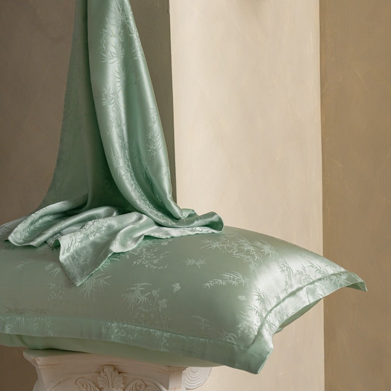 Birds And Flowers Green jacquard silk pillowcase in sage green with silk draped, single option
