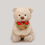 Plush teddy bear in soft short-pile fabric, seated upright in a front view