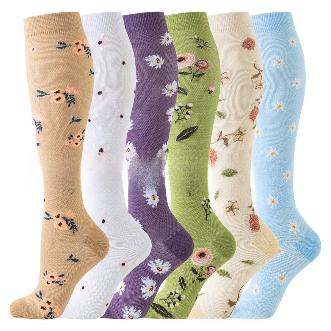 Assorted print knee high compression sport socks laid out side by side