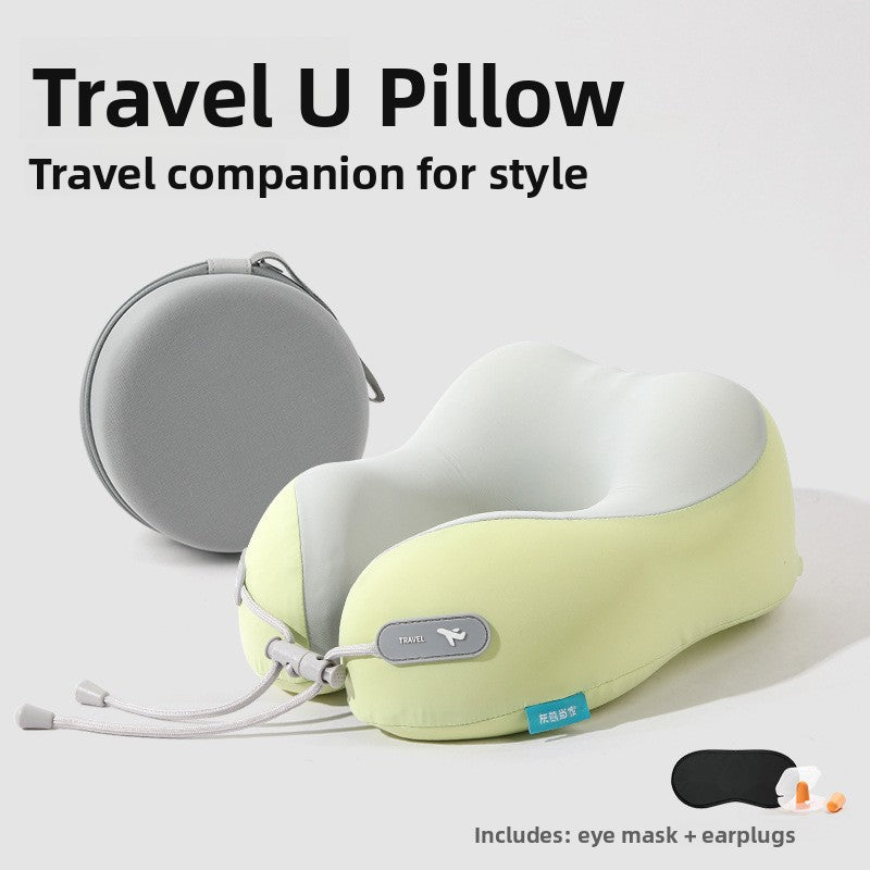 Light green and pale gray U shaped travel neck pillow beside a gray case with an eye mask and earplugs pictured