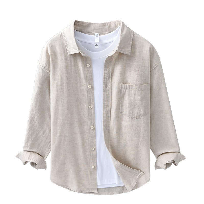 Front of the natural beige shirt layered open over a white tee on a hanger