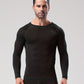 Man in a black long sleeve compression shirt with raglan sleeves, facing the camera