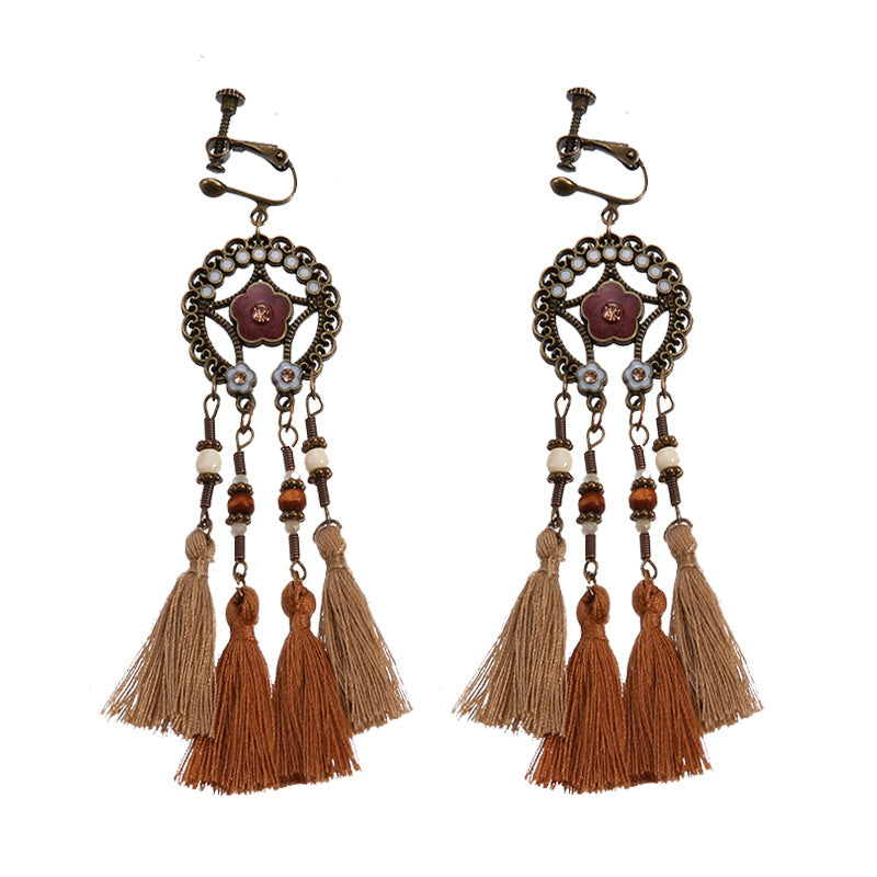 Vintage boho tassel clip-on earrings for non pierced ears, zinc alloy drop pair photographed on white background