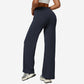 Navy blue high-waist flared yoga pants back view showing high waistband and seat seam, studio