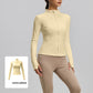 Woman in a pale yellow slim fit stand collar zip jacket with thumb holes, yellow swatch inset at the corner