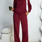 Burgundy fleece hooded sweatshirt and wide-leg sweatpants set worn by a model