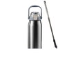 Reusable straw and silicone tip resting beside the tumbler
