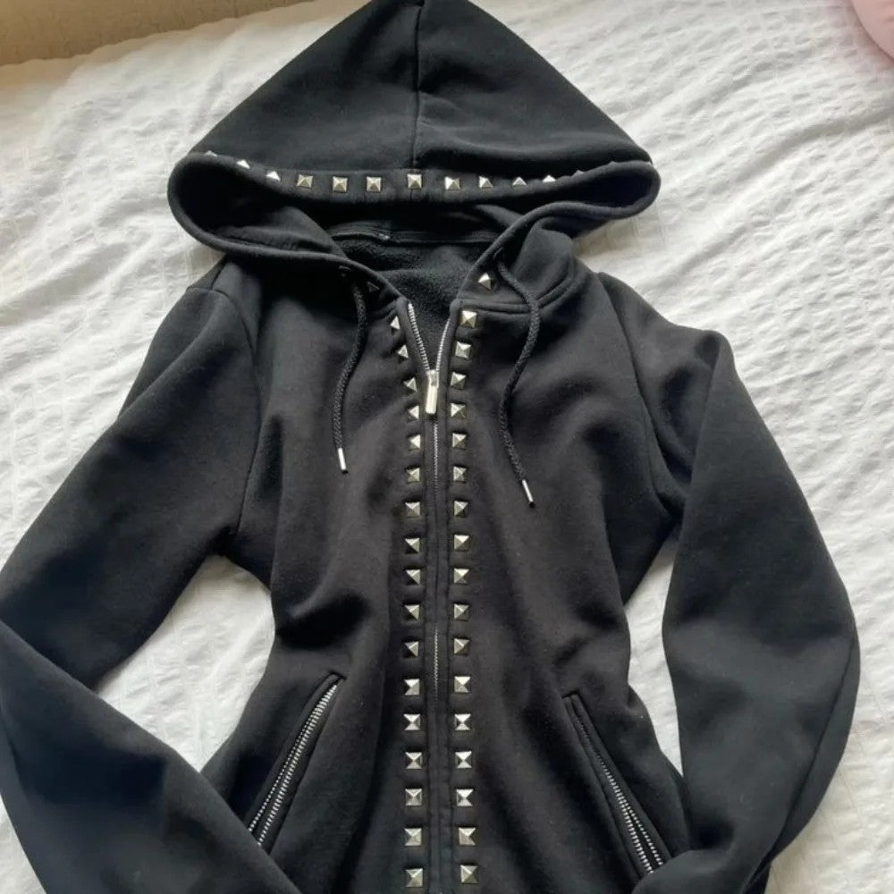 Close view of the black hoodie with a studded hood rim, drawstring cords and zip front placket studs