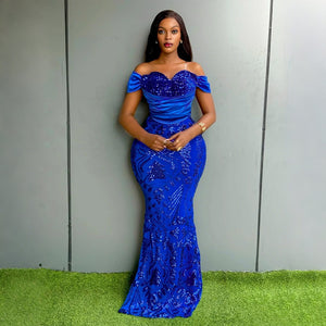 Blue sequin evening gown with a ruched off shoulder bodice, front view