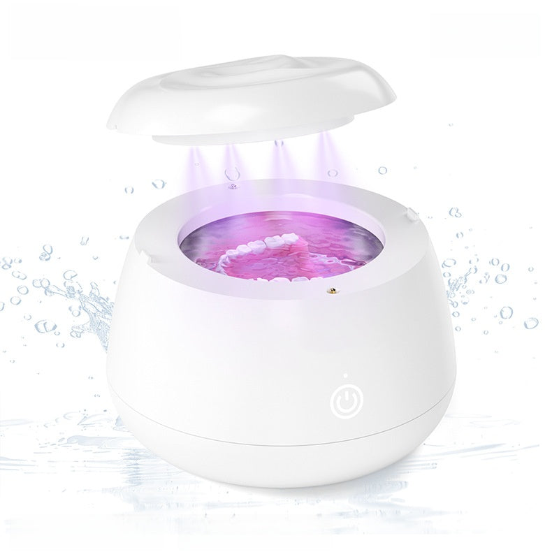 White portable ultrasonic cleaner with the lid lifted off the tank