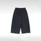 Close-up of the elastic drawstring waistband on the sweatpants