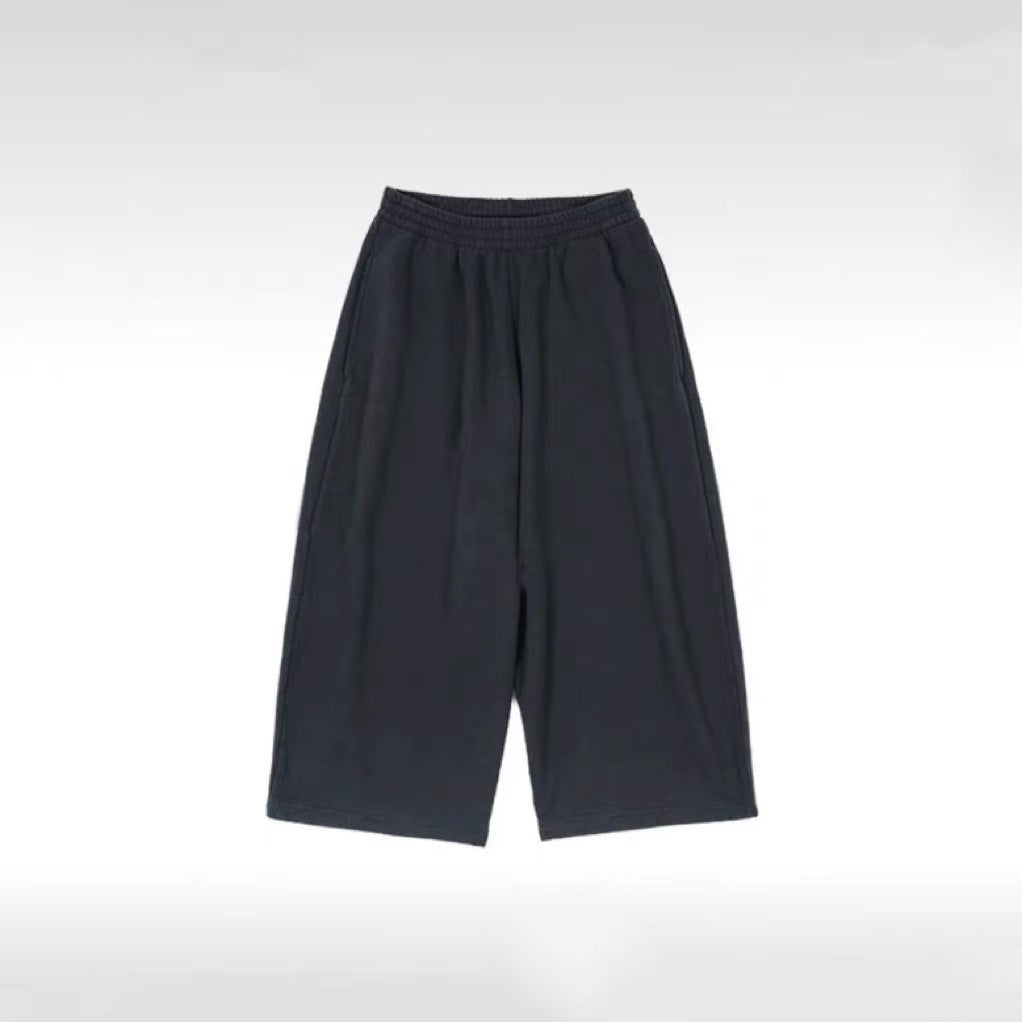 Close-up of the elastic drawstring waistband on the sweatpants