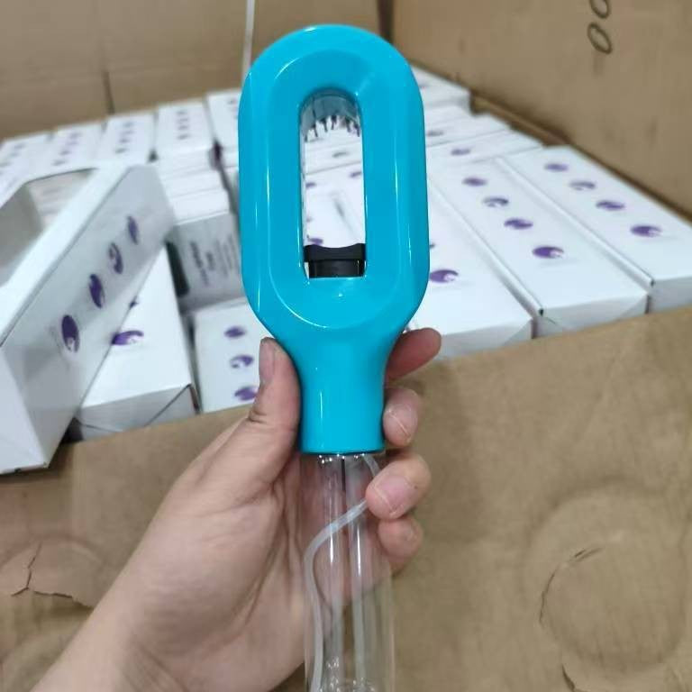 Atomizing hair spray comb releasing a fine water mist from its vented brush head