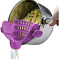Purple silicone clip-on pot strainer, variant photo, clipped to a pot held by hand with water draining