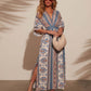 Full length ivory folk floral maxi dress in blue and rust, front view, Dark blue option photo