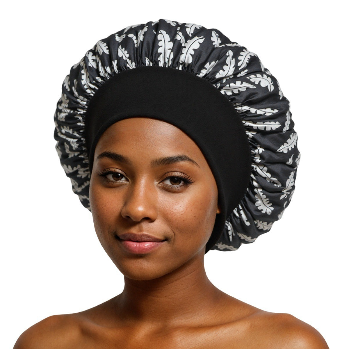 Black Leaf Print satin sleep bonnet with ruffled crown and wide elastic band, 30 cm diameter