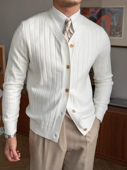 White ribbed knit mens V-neck cardigan worn over a shirt and tie, front studio view