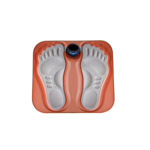 Foot massage pad with feet resting on it during a session