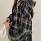 Loose fit hooded plaid shirt front view in navy blue