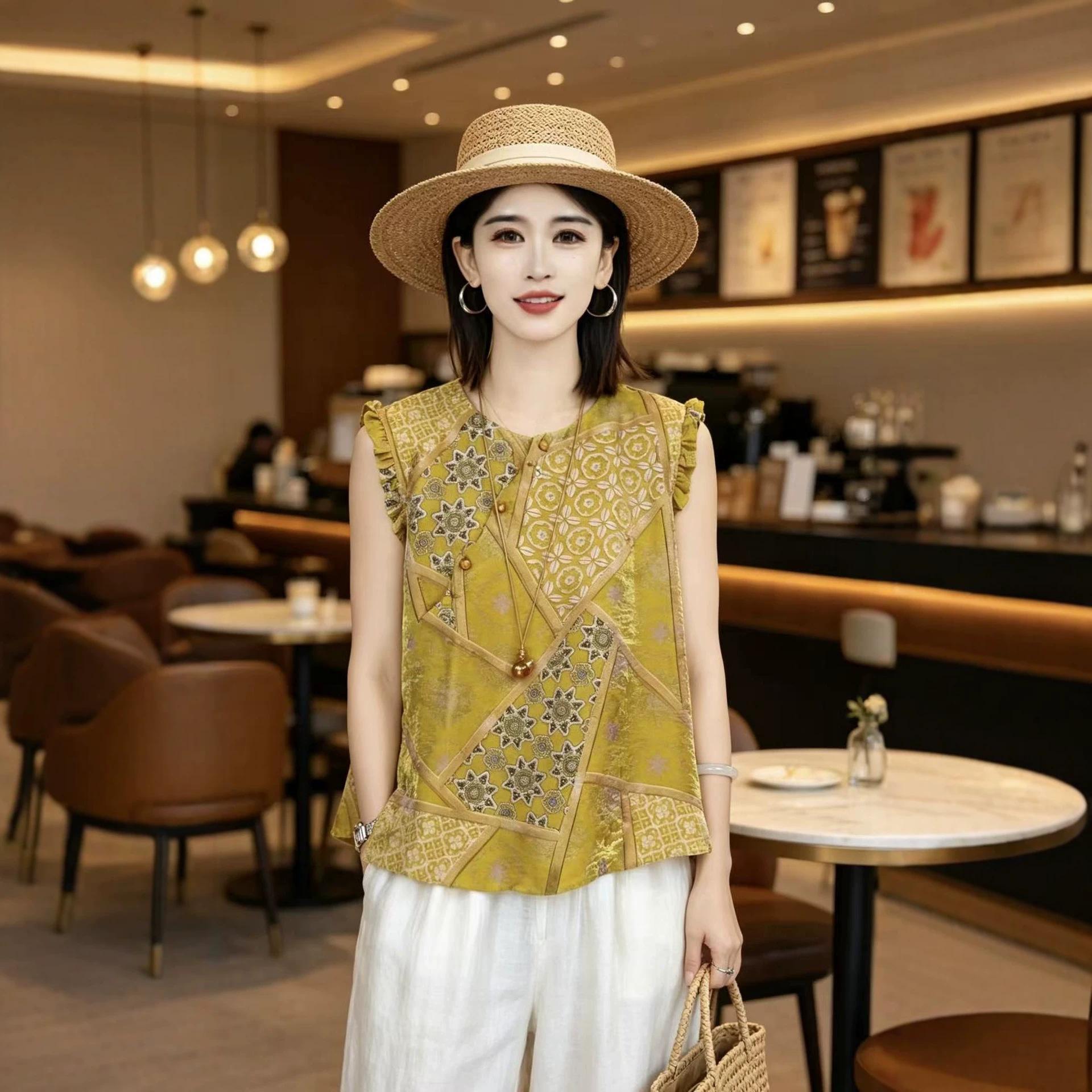 Front view of yellow jacquard sleeveless blouse with white wide-leg trousers