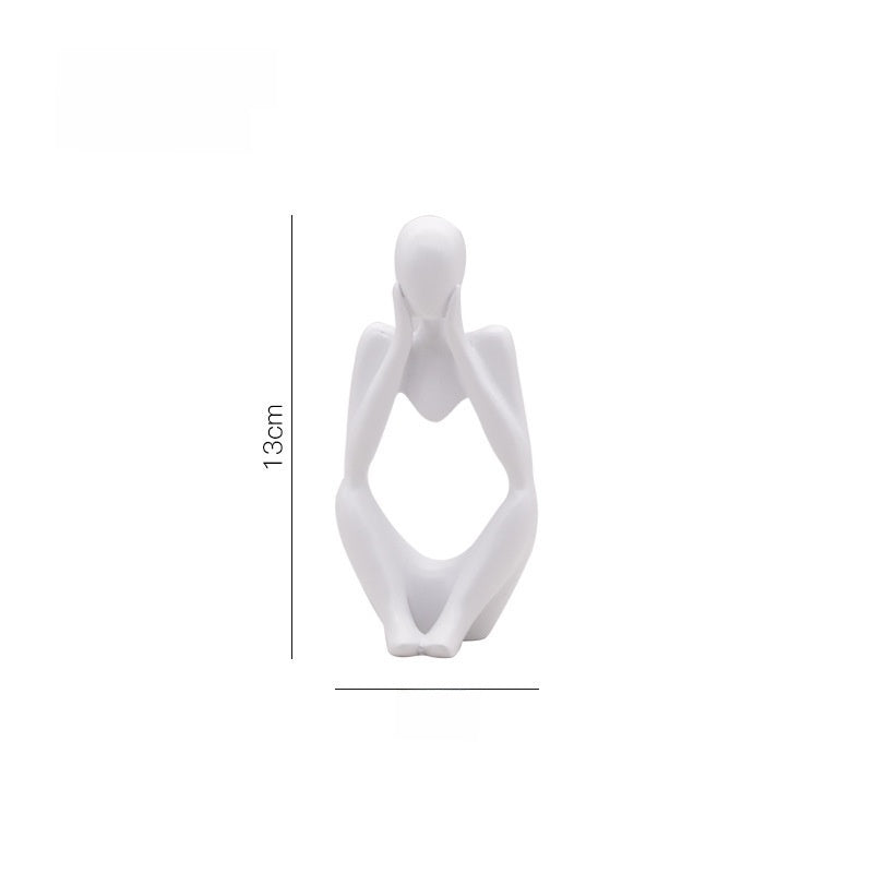 White abstract resin meditator figurine with a 13 cm height marker on a plain background