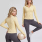 Front and back views of a yellow slim fit zip jacket worn with grey leggings