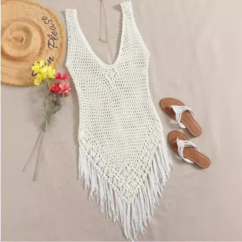 Bohemian crochet beach cover-up with an open floral knit and tassel fringe hem