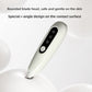 White pet grooming trimmer with a rounded safety blade head resting on a pale studio surface
