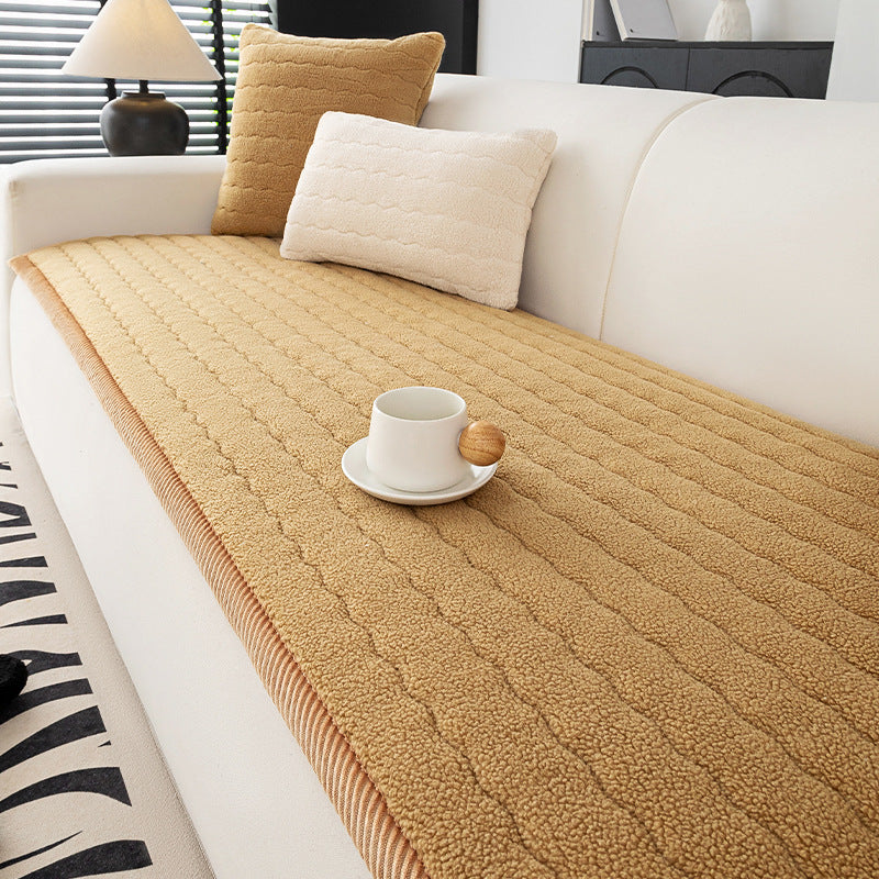 Quilted lambswool sofa cover with a wave stitch face on a sofa