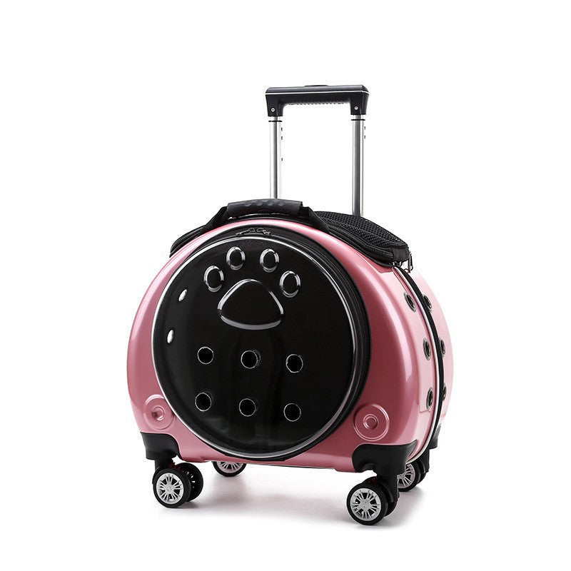 Pink metallic pet carrier on wheels with a black paw-print window pierced with air holes and a telescopic handle