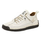 Hand-stitched casual shoe shown from the front with laces